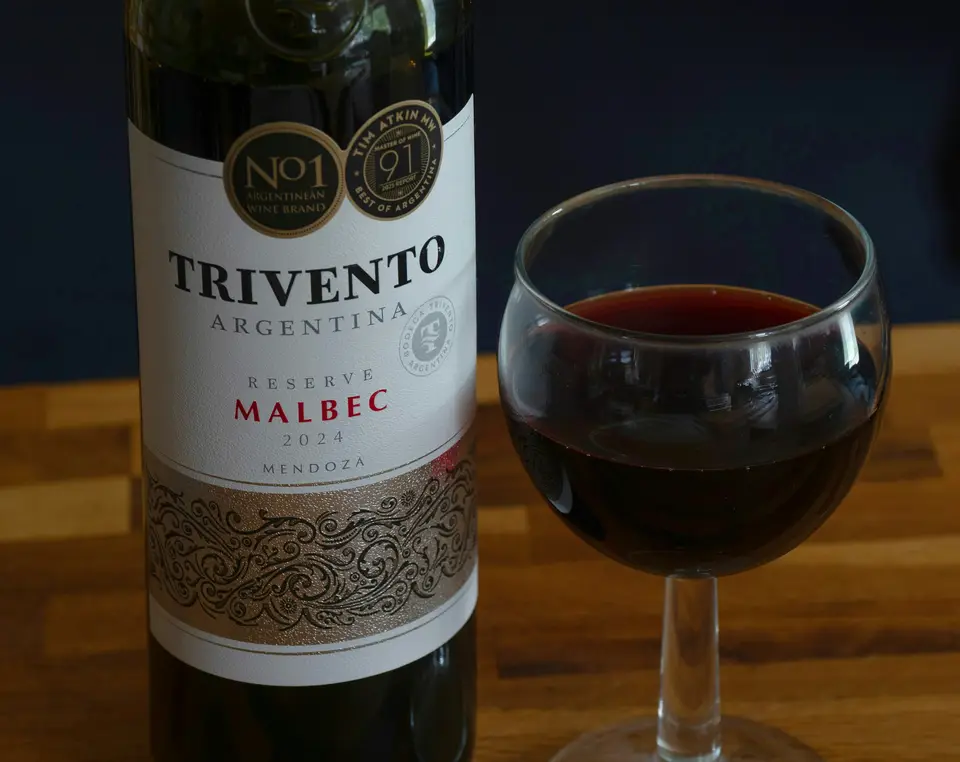 Trivento malbec wine bottle and a full glass — Mendoza
