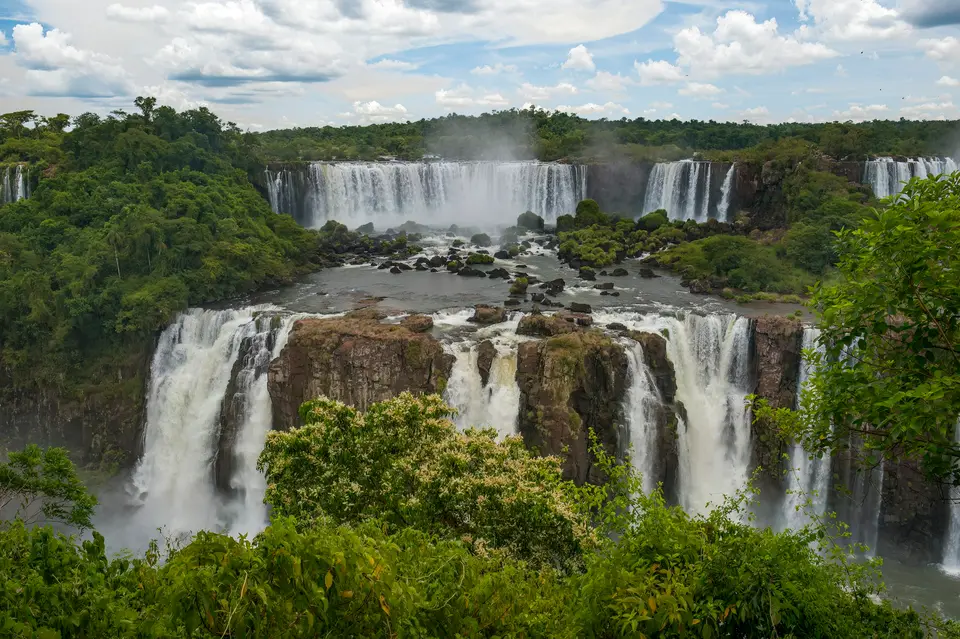 a large waterfall surrounded by lush green trees — Puerto Iguazú