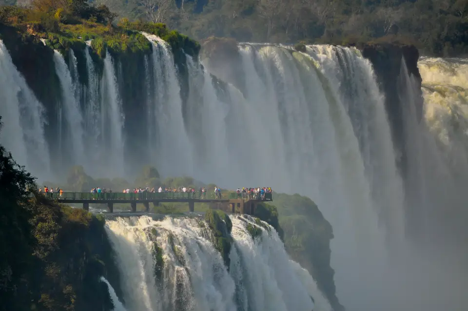 people looking at large waterfall — Puerto Iguazú