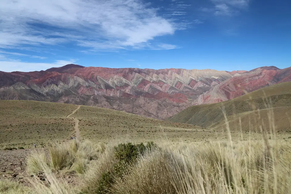 Colorful mountain range under a bright, blue sky — Quebrada de Humahuaca