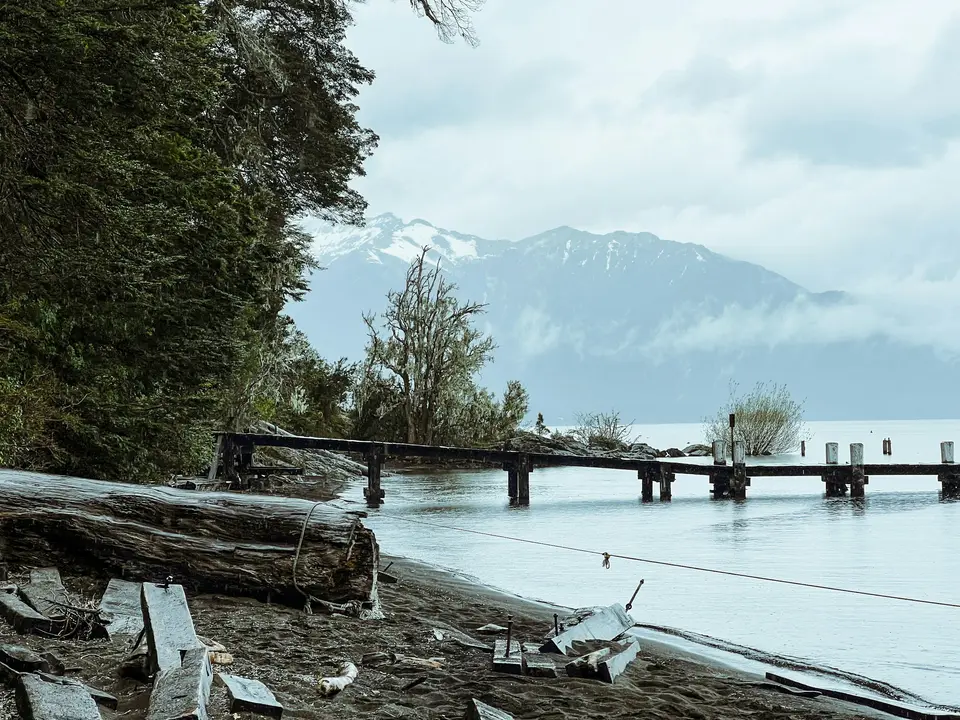 a wooden bridge over a body of water — Villa La Angostura